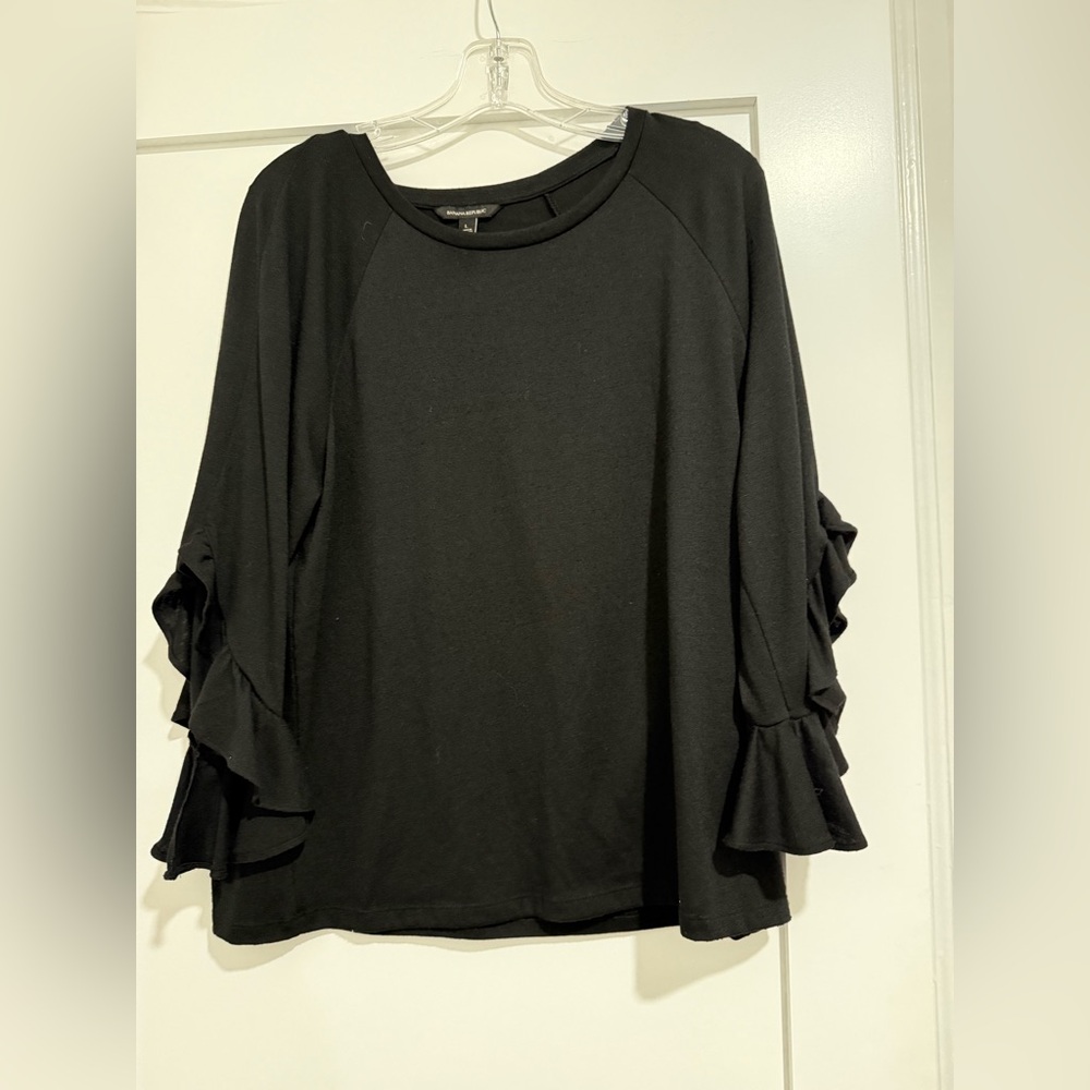Banana Republic Black long sleeve top w/ ruffle sleeves (fair)